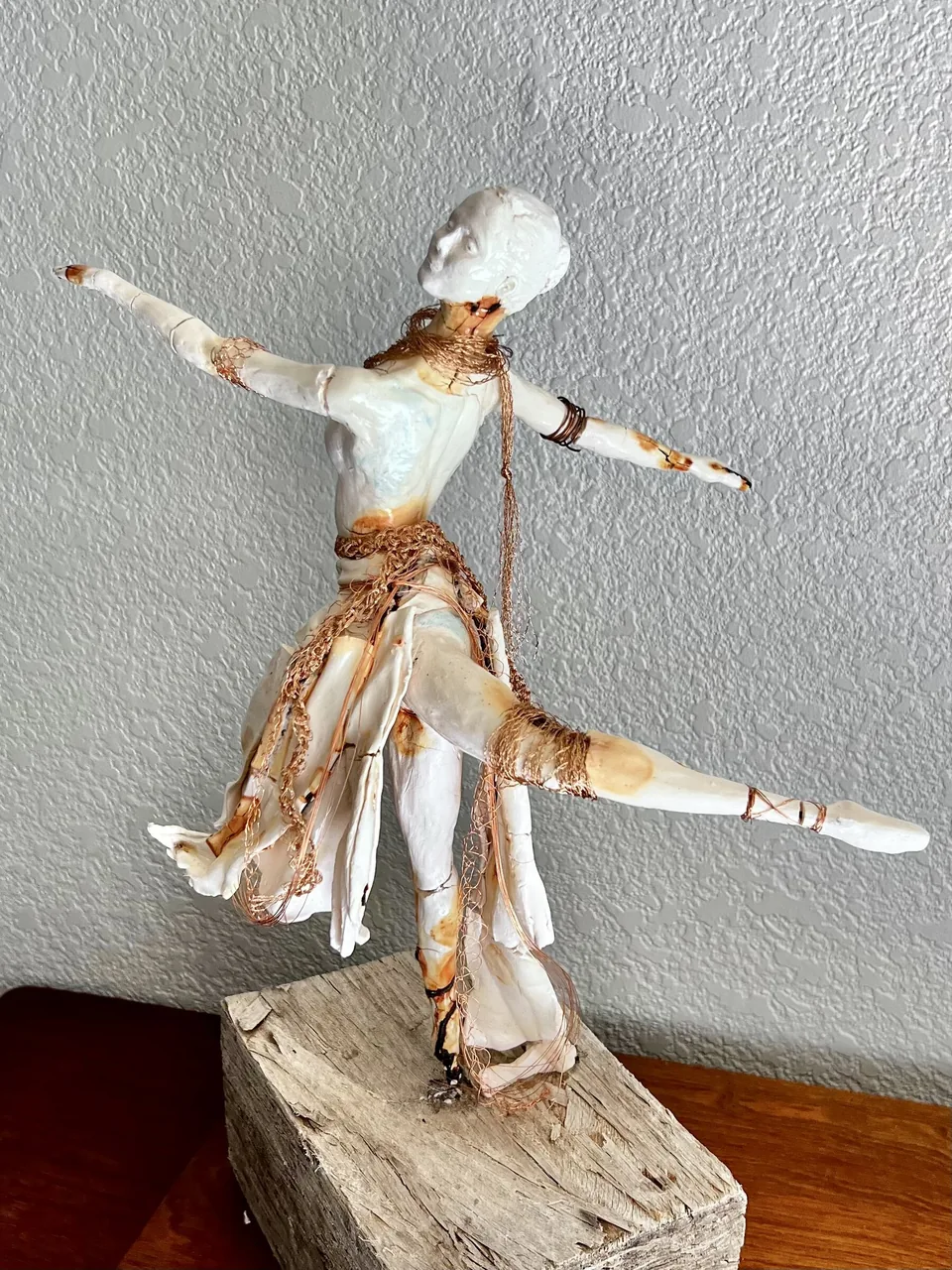 Wire and clay sculpture titled Copper Dance by Laura Sapko.